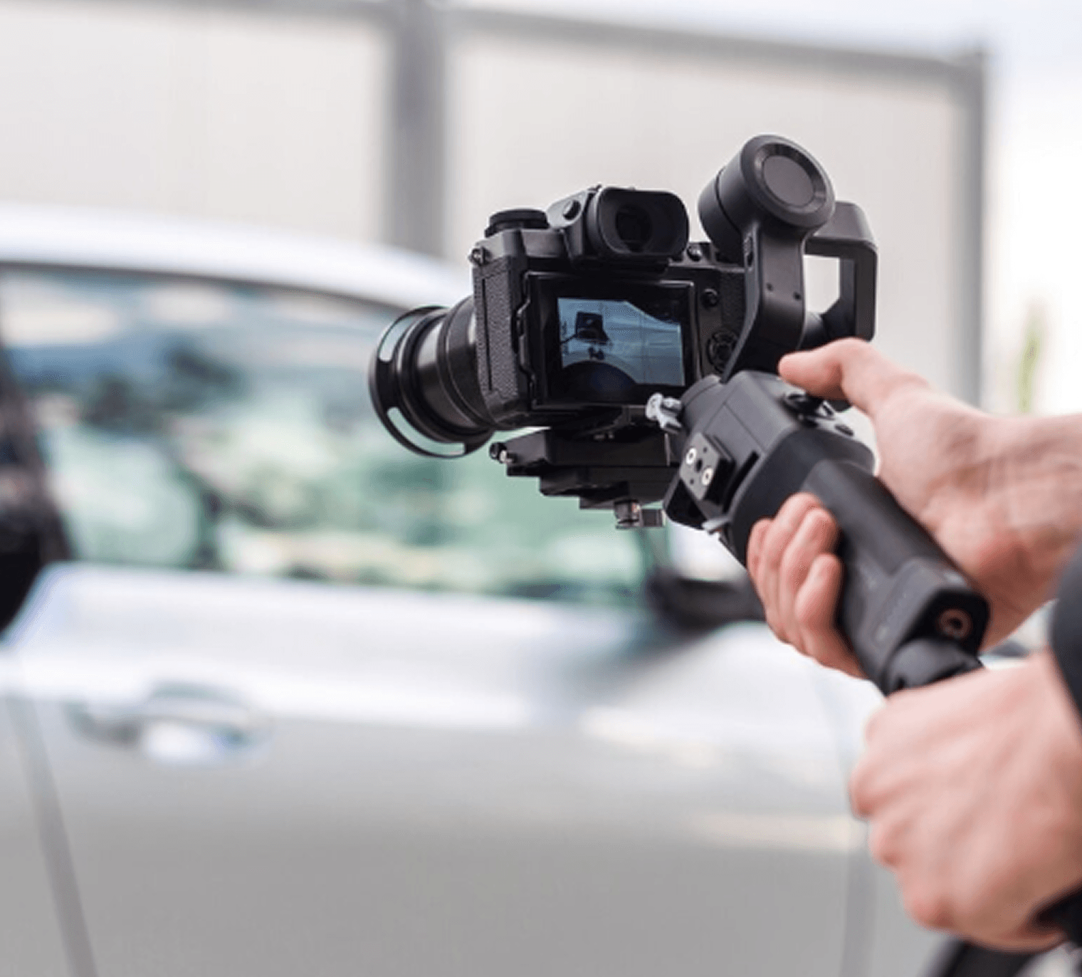 Person holding a phone with a car finance app